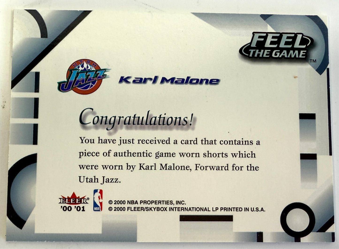 Karl Malone 2000-01 Fleer Official Game Worn Jersey Feel the game card #KM1